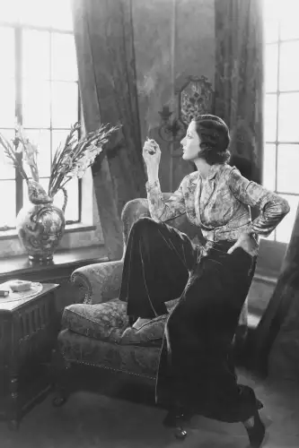 Woman smoking in chair 