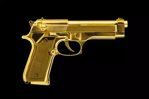 Isolated golden pistol 