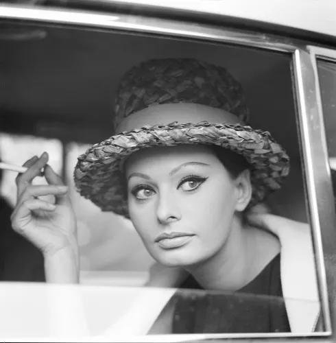Sophia smoking in a car